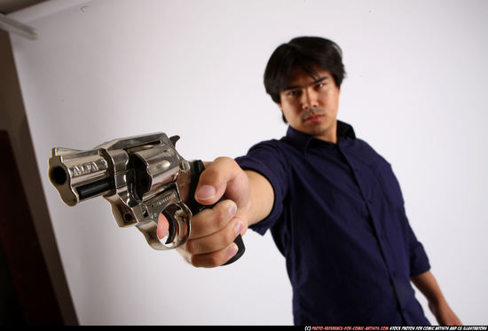 Man Adult Average Fighting with gun Standing poses Casual Asian