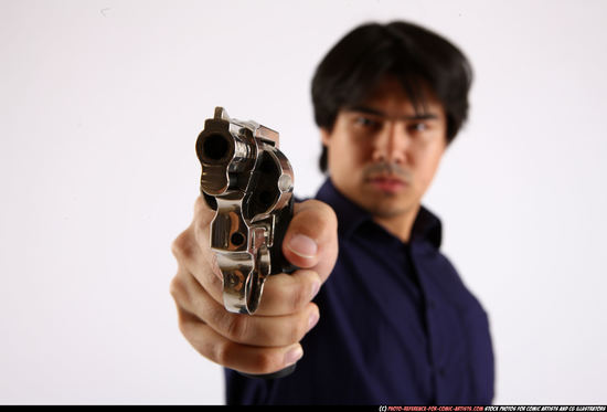 Man Adult Average Fighting with gun Standing poses Casual Asian