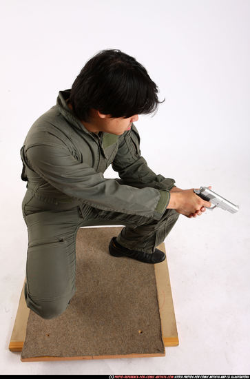 Man Adult Average Fighting with gun Kneeling poses Army Asian