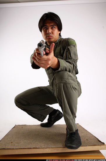 Man Adult Average Fighting with gun Kneeling poses Army Asian