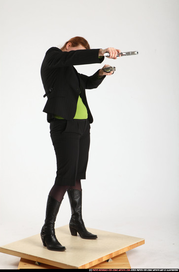 Woman Adult Average White Fighting with gun Standing poses Business