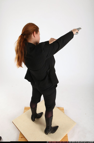 Woman Adult Average White Fighting with gun Standing poses Business