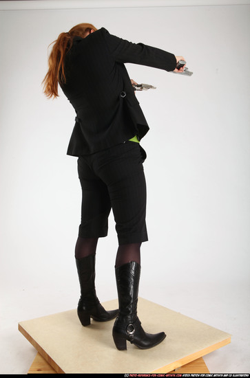 Woman Adult Average White Fighting with gun Standing poses Business