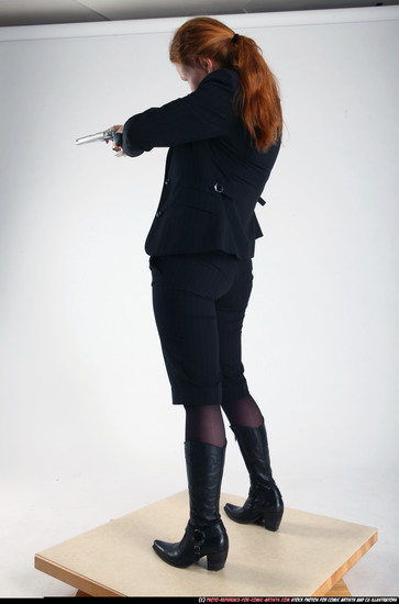 Woman Adult Average White Fighting with gun Standing poses Business