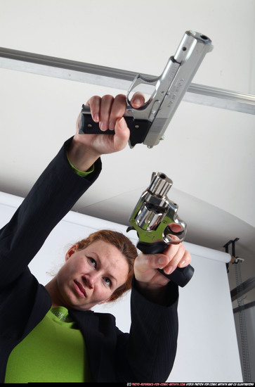 Woman Adult Average White Fighting with gun Standing poses Business