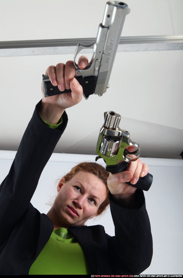 Woman Adult Average White Fighting with gun Standing poses Business