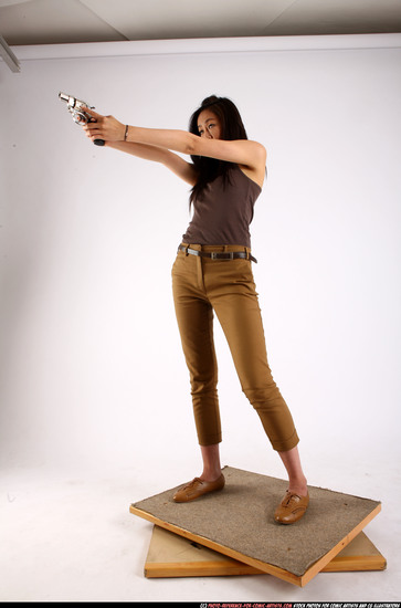 Woman Young Athletic Fighting with gun Standing poses Casual Asian