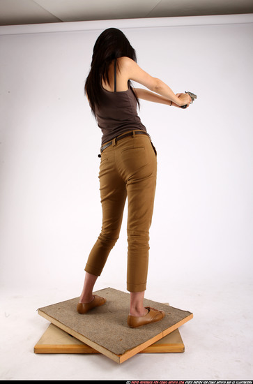 Woman Young Athletic Fighting with gun Standing poses Casual Asian