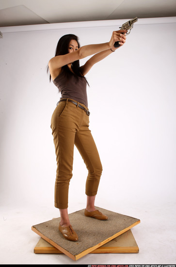 Woman Young Athletic Fighting with gun Standing poses Casual Asian