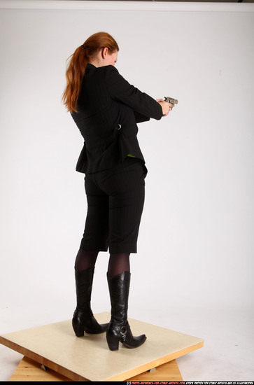 Woman Adult Average White Fighting with gun Standing poses Business