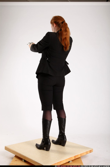 Woman Adult Average White Fighting with gun Standing poses Business