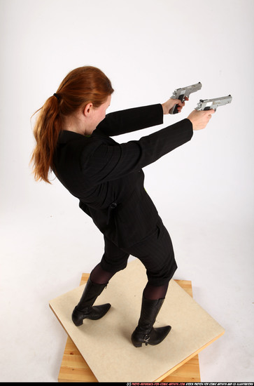 Woman Adult Average White Fighting with gun Standing poses Business