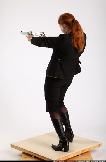 Woman Adult Average White Fighting with gun Standing poses Business