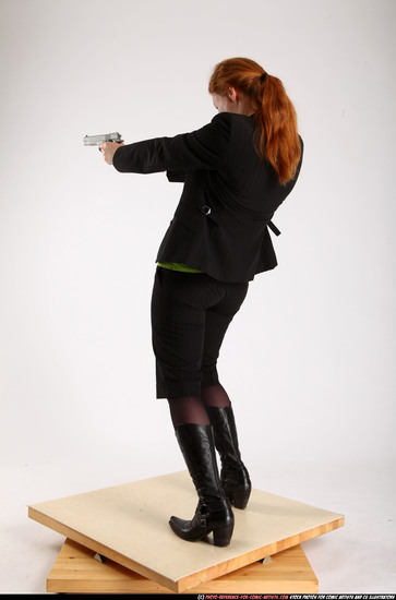 Woman Adult Average White Fighting with gun Standing poses Business