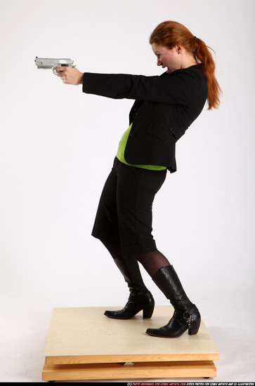 Woman Adult Average White Fighting with gun Standing poses Business