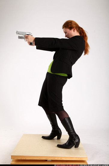 Woman Adult Average White Fighting with gun Standing poses Business