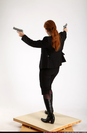 Woman Adult Average White Fighting with gun Standing poses Business