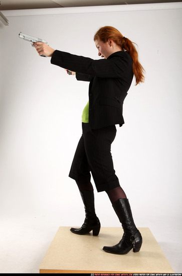 Woman Adult Average White Fighting with gun Standing poses Business