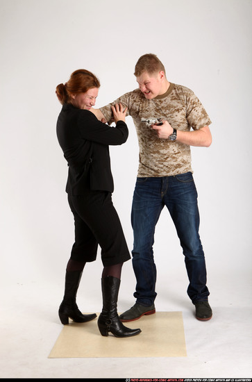 Man & Woman Adult Average White Fighting with gun Standing poses Casual