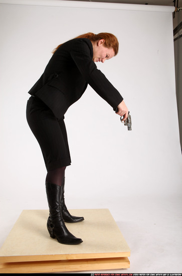 Woman Adult Average White Fighting with gun Standing poses Business