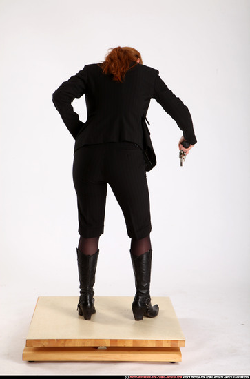 Woman Adult Average White Fighting with gun Standing poses Business