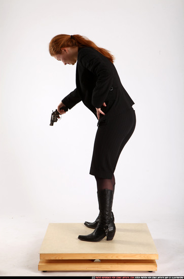 Woman Adult Average White Fighting with gun Standing poses Business