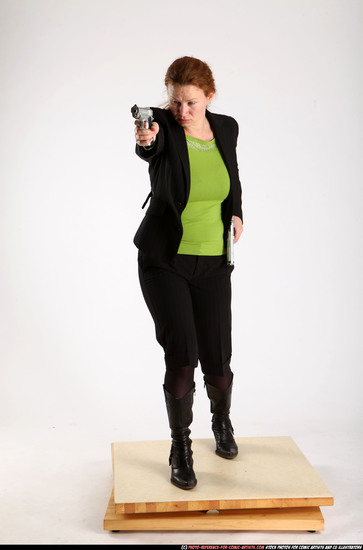 Woman Adult Average White Fighting with gun Standing poses Business