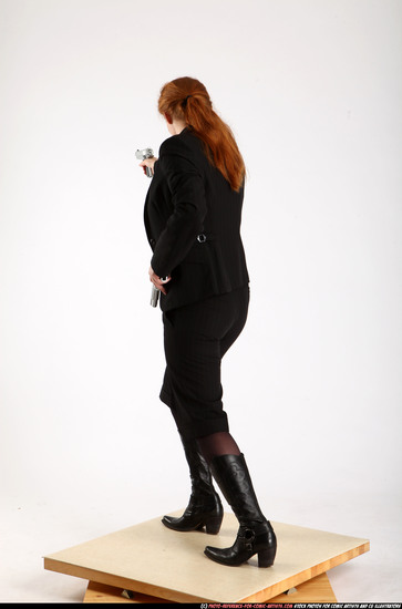 Woman Adult Average White Fighting with gun Standing poses Business