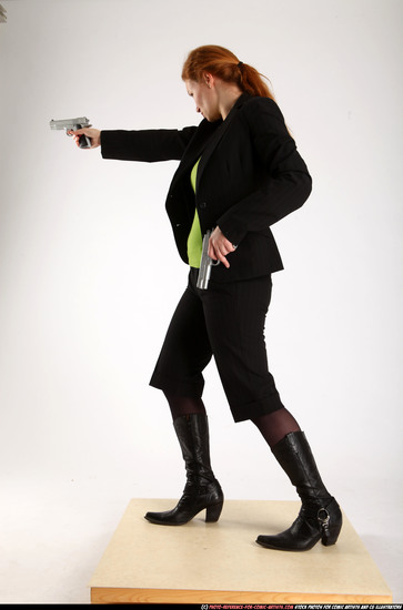 Woman Adult Average White Fighting with gun Standing poses Business