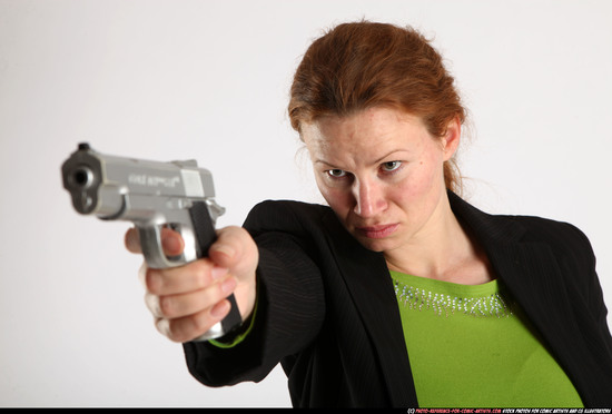 Woman Adult Average White Fighting with gun Standing poses Business