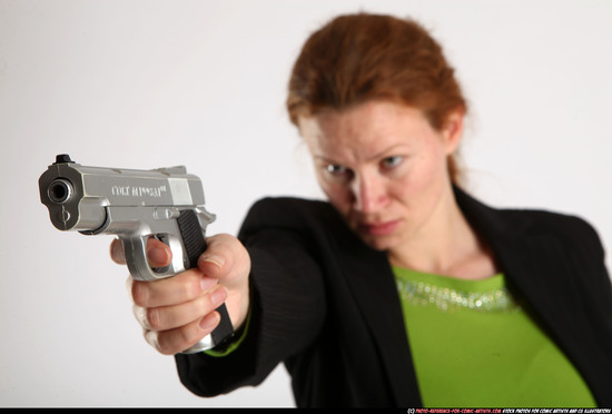 Woman Adult Average White Fighting with gun Standing poses Business