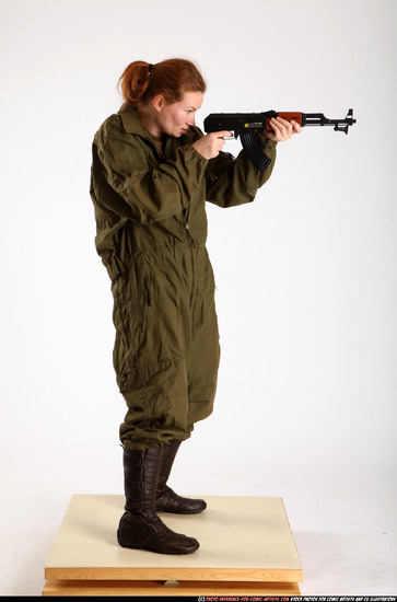 Woman Adult Average White Fighting with submachine gun Standing poses Army