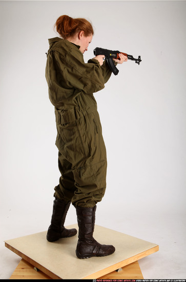 Woman Adult Average White Fighting with submachine gun Standing poses Army