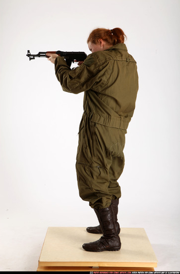 Woman Adult Average White Fighting with submachine gun Standing poses Army