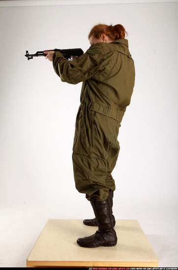 Woman Adult Average White Fighting with submachine gun Standing poses Army