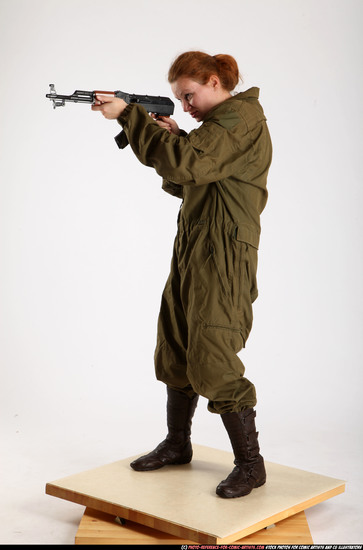 Woman Adult Average White Fighting with submachine gun Standing poses Army