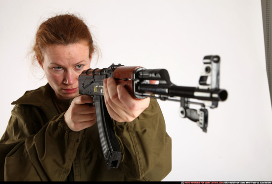 Woman Adult Average White Fighting with submachine gun Standing poses Army