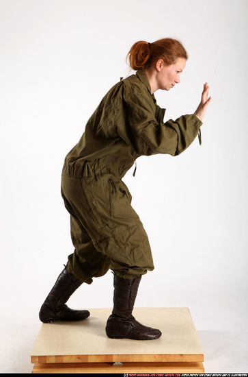 Woman Adult Average White Fist fight Standing poses Army