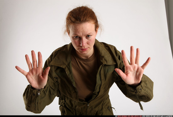 Woman Adult Average White Fist fight Standing poses Army