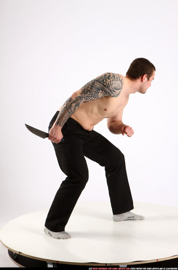 Man Adult Athletic White Fighting with knife Standing poses Pants