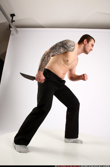 Man Adult Athletic White Fighting with knife Standing poses Pants