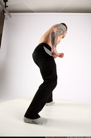 Man Adult Athletic White Fighting with knife Standing poses Pants