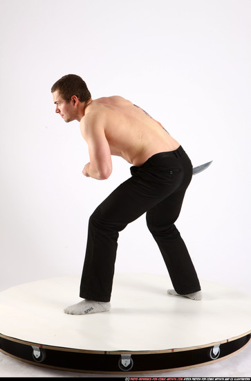 Man Adult Athletic White Fighting with knife Standing poses Pants