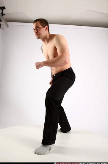 Man Adult Athletic White Fighting with knife Standing poses Pants