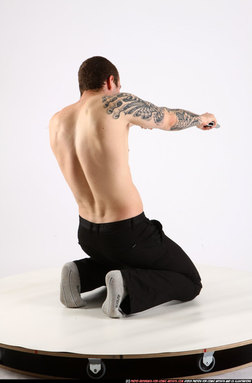 Man Adult Athletic White Fighting with gun Kneeling poses Pants