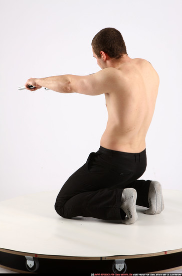 Man Adult Athletic White Fighting with gun Kneeling poses Pants