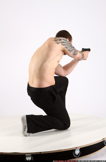 Man Adult Athletic White Fighting with gun Kneeling poses Pants