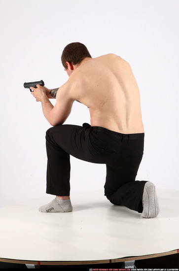 Man Adult Athletic White Fighting with gun Kneeling poses Pants