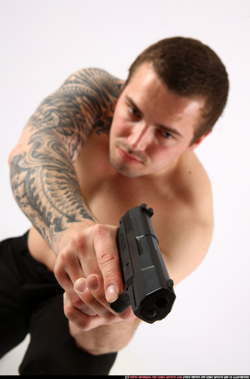 Man Adult Athletic White Fighting with gun Kneeling poses Pants