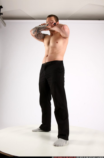 Man Adult Athletic White Fighting with knife Standing poses Pants